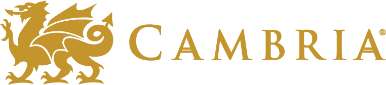 Cambria logo featuring a gold dragon on the left, followed by the word CAMBRIA in gold capital letters with a classic serif font on a transparent background. -Precision Flooring