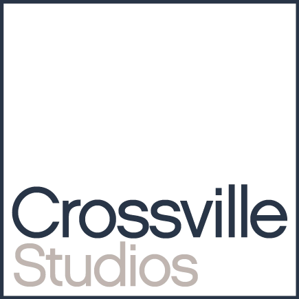 Crossville Studios logo with the word Crossville in dark gray and Studios in light gray, set against a white background and framed by a thin dark gray square border. -Precision Flooring
