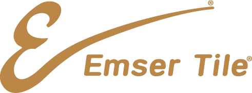 Emser Tile logo featuring a stylized, gold letter E followed by the words Emser Tile in gold, all on a transparent background. -Precision Flooring
