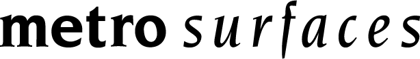 A silhouette of a person jumping between two cliffs or rocks with arms and legs outstretched, set against a white background. -Precision Flooring